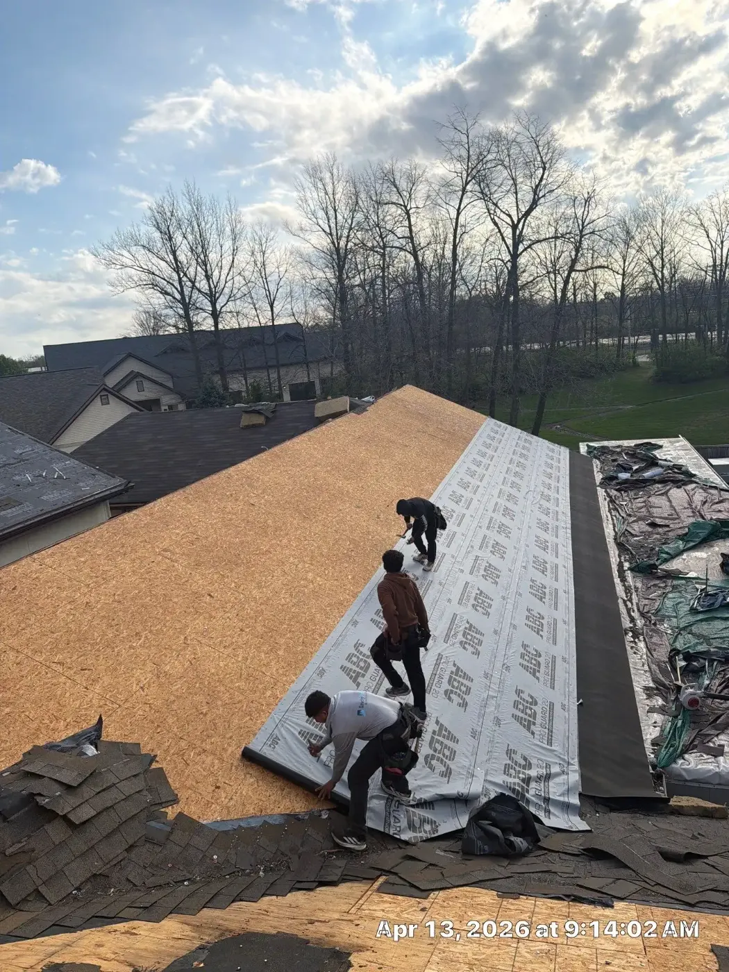 Tarping and dry-in on a Mount Comfort commercial roof